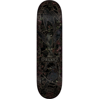 A skateboard deck shown vertically against a plain white background, featuring a dark black base with an intricate stained-glass style illustration of birds and roses in muted pink, green, and gray tones. The brand name 'Bulker' is clearly visible in the center.